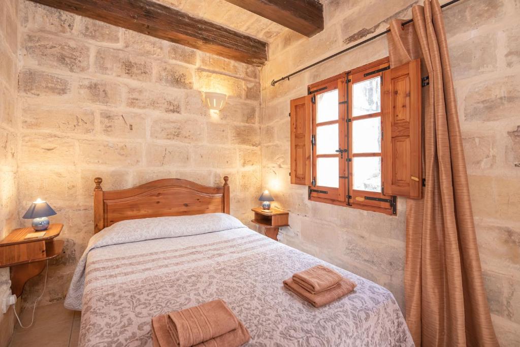 Postel nebo postele na pokoji v ubytování Casa Melita