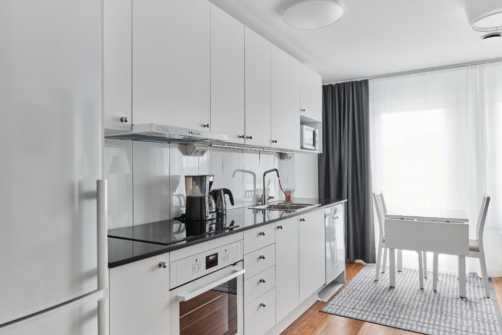 Kuchyň nebo kuchyňský kout v ubytování Continental Apartment Hotel Knivsta