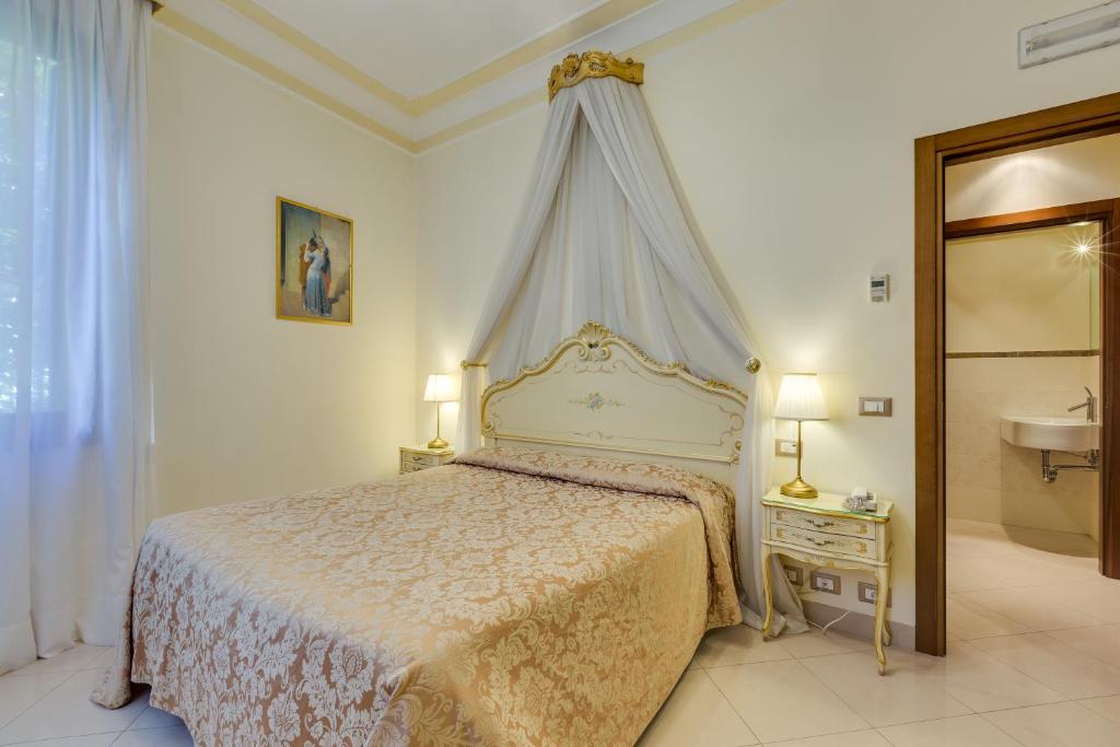 Posteľ alebo postele v izbe v ubytovaní Hotel Marte