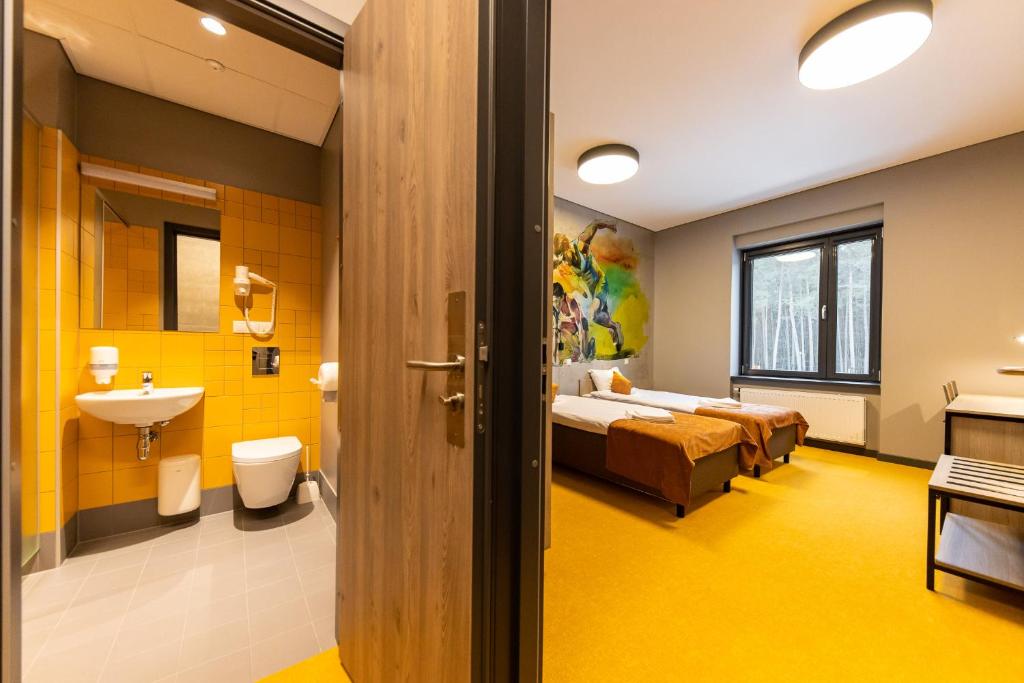 Postel nebo postele na pokoji v ubytování Stadium Hotel