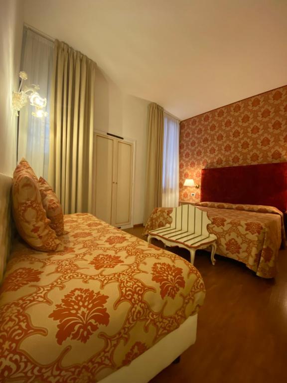 Postel nebo postele na pokoji v ubytování Locanda Casa Querini