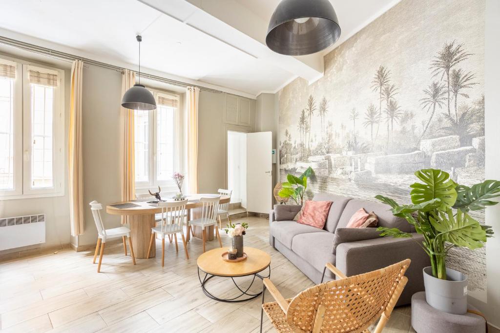 a living room with a couch and a table at Edwin Suites in Paris