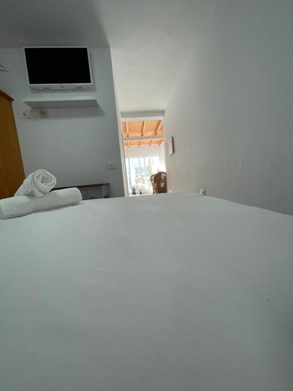 A bed or beds in a room at Apartamentos Elena