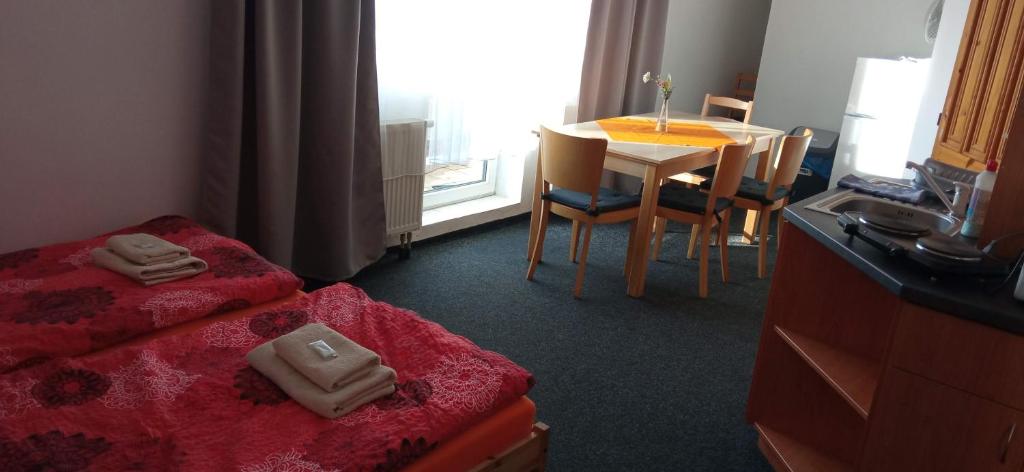 Postel nebo postele na pokoji v ubytování Penzion U Hyklů