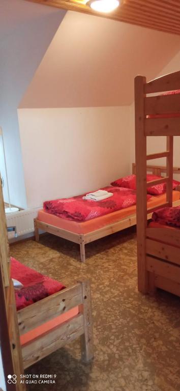 Postel nebo postele na pokoji v ubytování Penzion U Hyklů