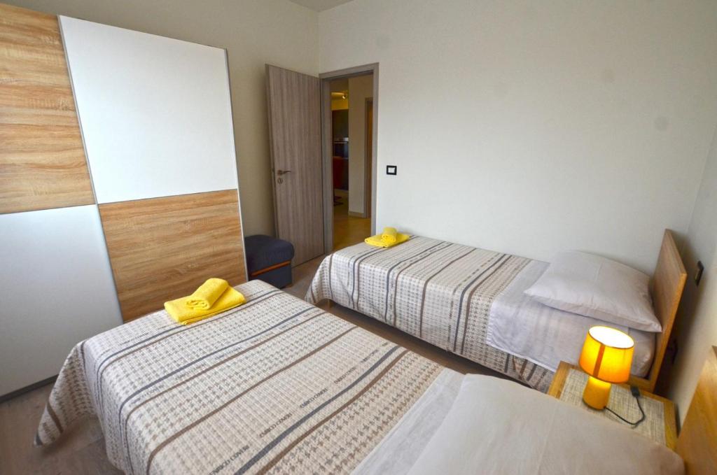 Postel nebo postele na pokoji v ubytování Emilio Apartment