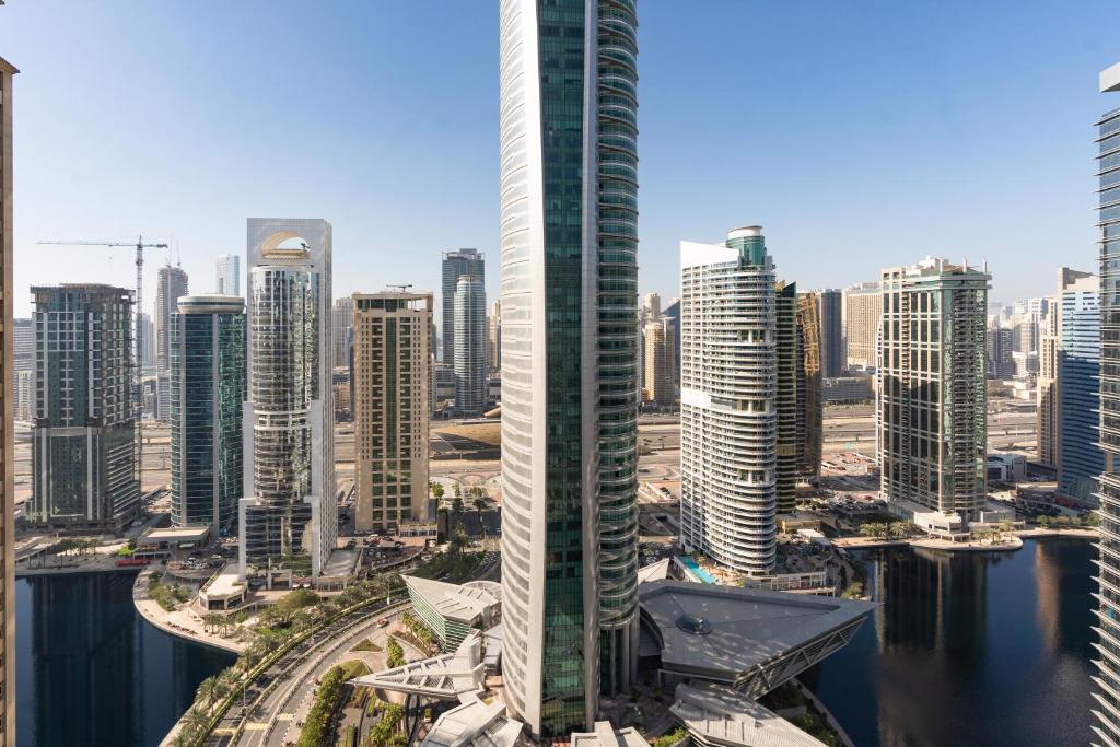 a view of a city with tall buildings at Royal Club By RVHR, Bonnington Residential Tower - JLT in Dubai