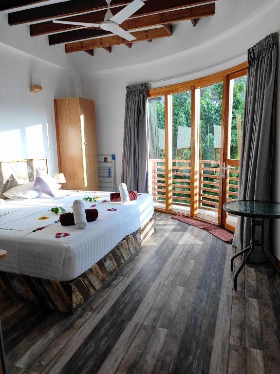 Postel nebo postele na pokoji v ubytování Cowry Inn