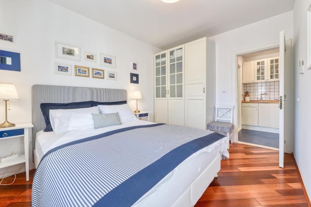 Posteľ alebo postele v izbe v ubytovaní Blumarine Apartments