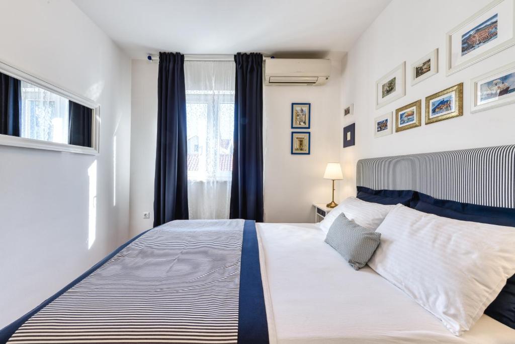 Posteľ alebo postele v izbe v ubytovaní Blumarine Apartments