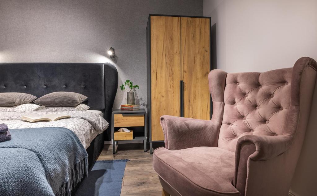 Postel nebo postele na pokoji v ubytování Apartamenty 73
