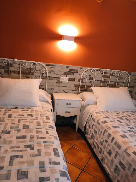 Postel nebo postele na pokoji v ubytování Casa Arroyo Los Ubios Arroyo Frio