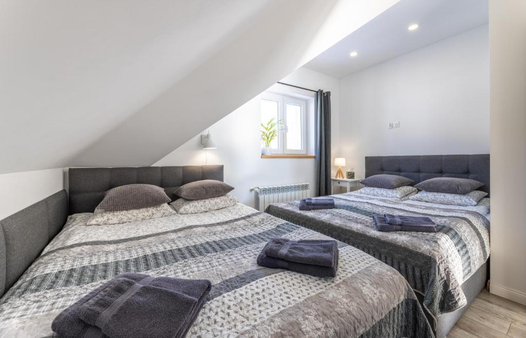 Postel nebo postele na pokoji v ubytování Apartamenty 73
