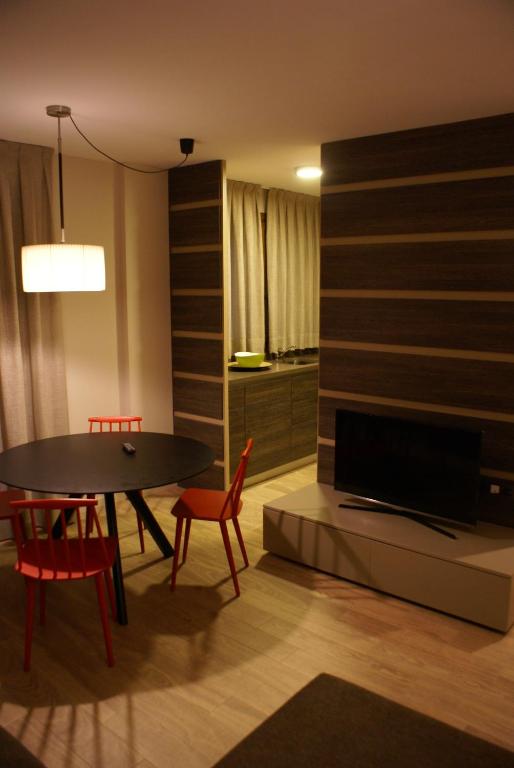 TV a/nebo společenská místnost v ubytování Apartamentos Casa Roldan