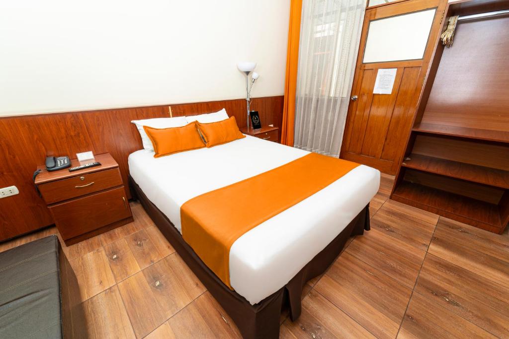 Postel nebo postele na pokoji v ubytování Hotel El Turista