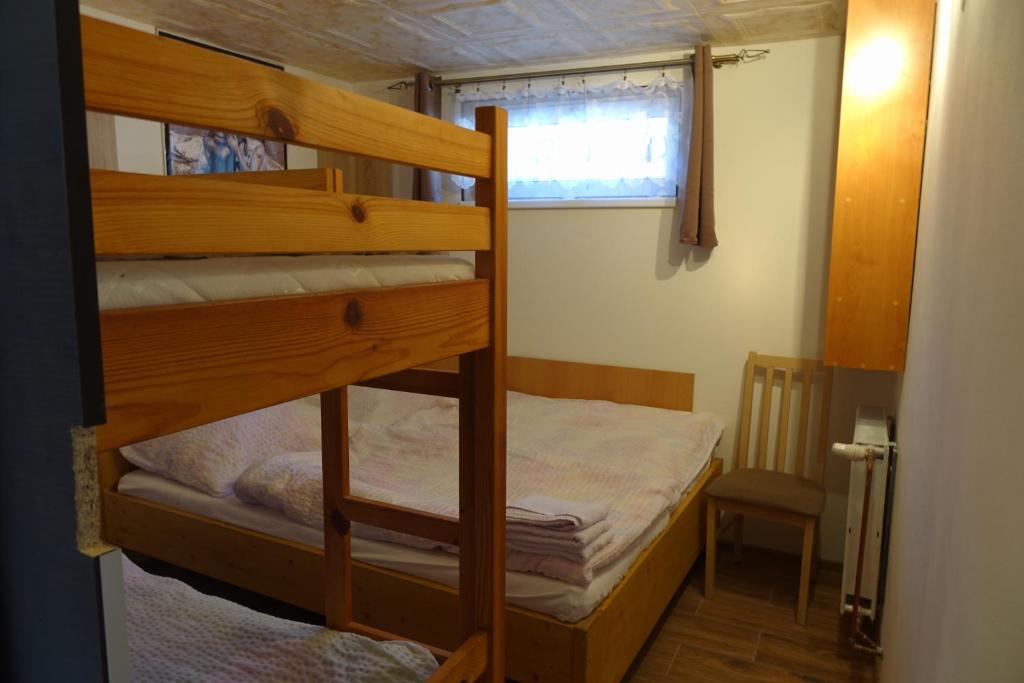 Posteľ alebo postele v izbe v ubytovaní Apartmány u Bernardů