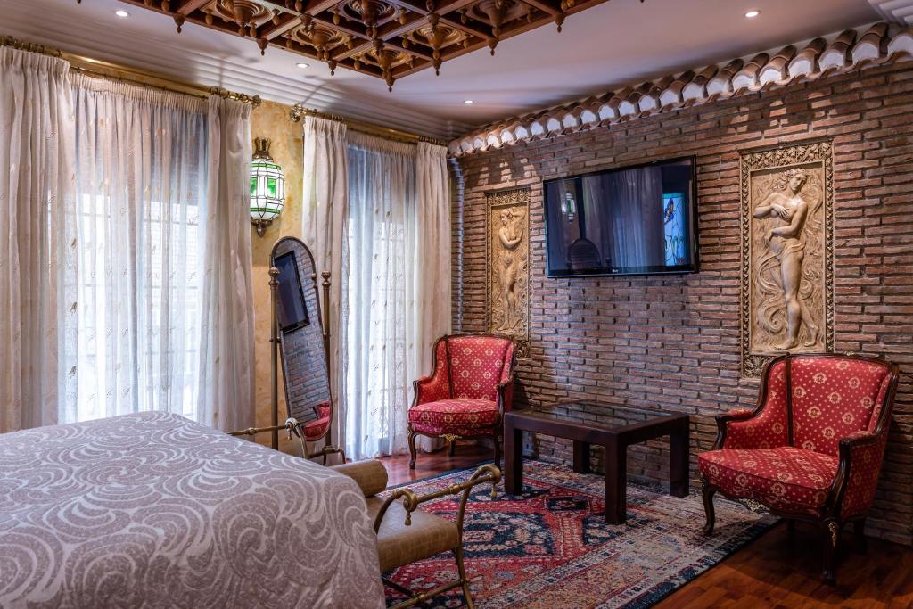 TV a/nebo společenská místnost v ubytování Casa de Reyes