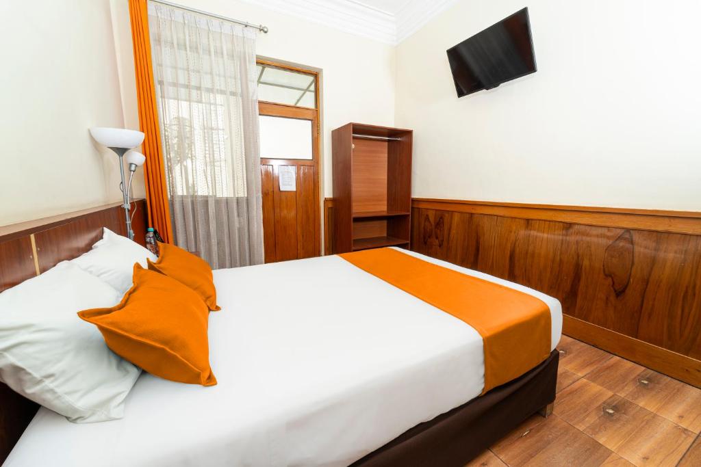Postel nebo postele na pokoji v ubytování Hotel El Turista