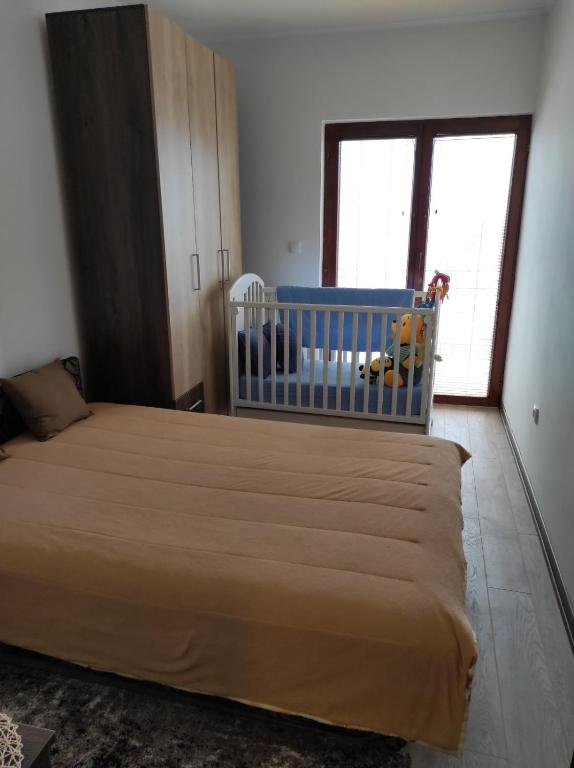 Postel nebo postele na pokoji v ubytování Apartman Vukan
