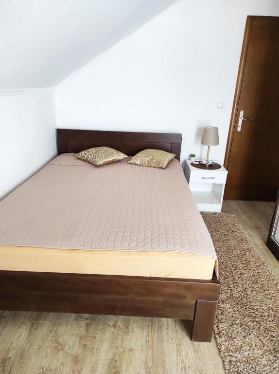 Postel nebo postele na pokoji v ubytování Apartman Vukan