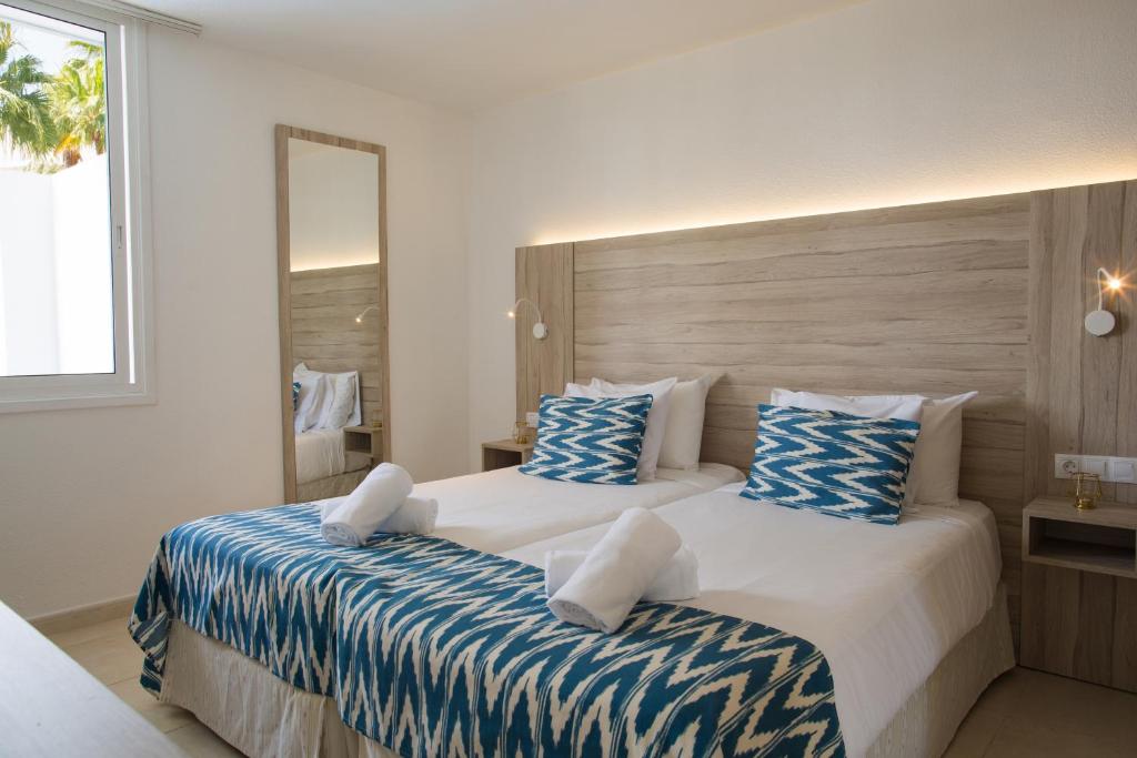 A bed or beds in a room at Playa Del Sol - Adults Only