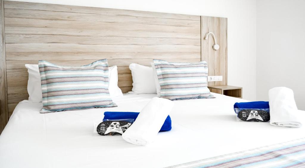 A bed or beds in a room at Playa Del Sol - Adults Only