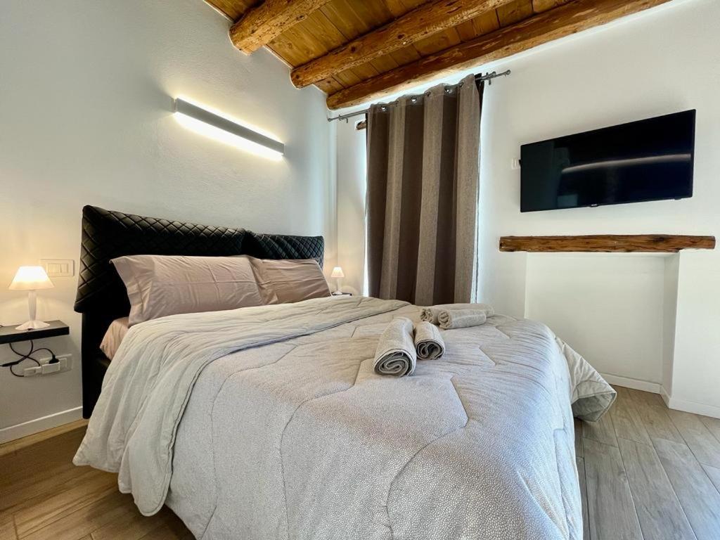 Łóżko lub łóżka w pokoju w obiekcie UnicumHouse Verona
