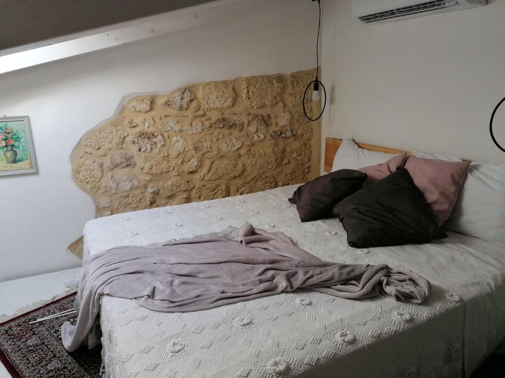 Postel nebo postele na pokoji v ubytování Il Cortiletto di Via Minniti