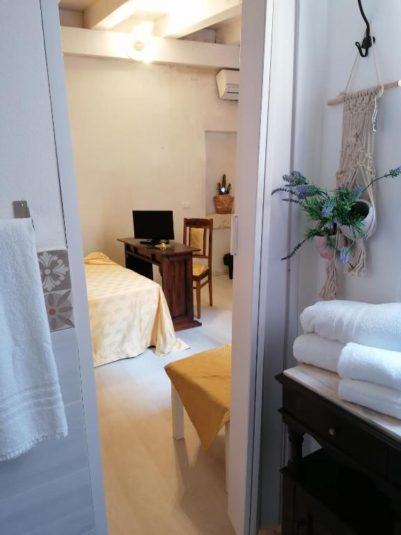 Postel nebo postele na pokoji v ubytování Il Cortiletto di Via Minniti