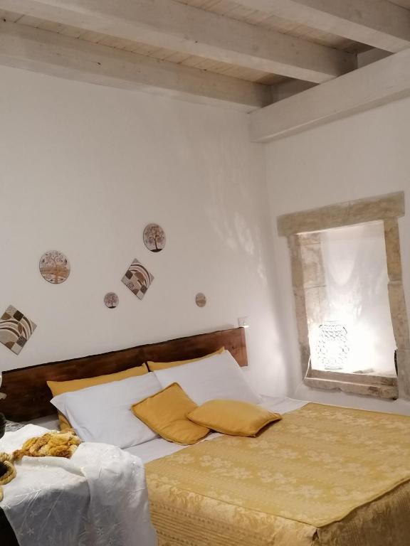 Postel nebo postele na pokoji v ubytování Il Cortiletto di Via Minniti