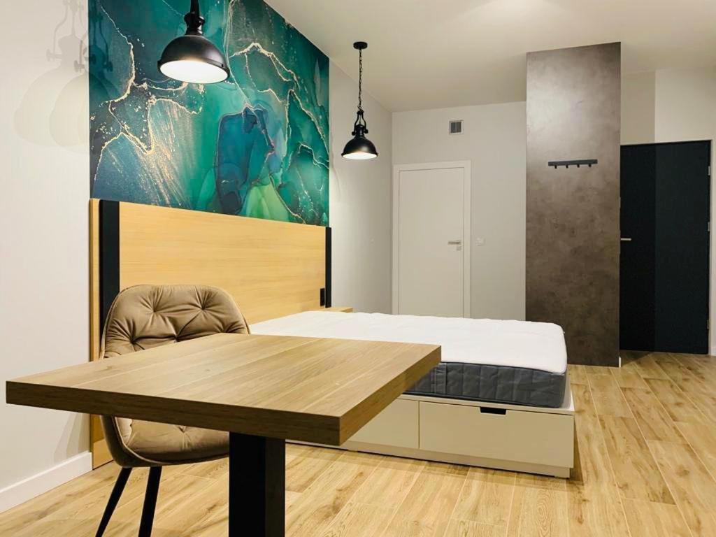 Postel nebo postele na pokoji v ubytování W Apartments