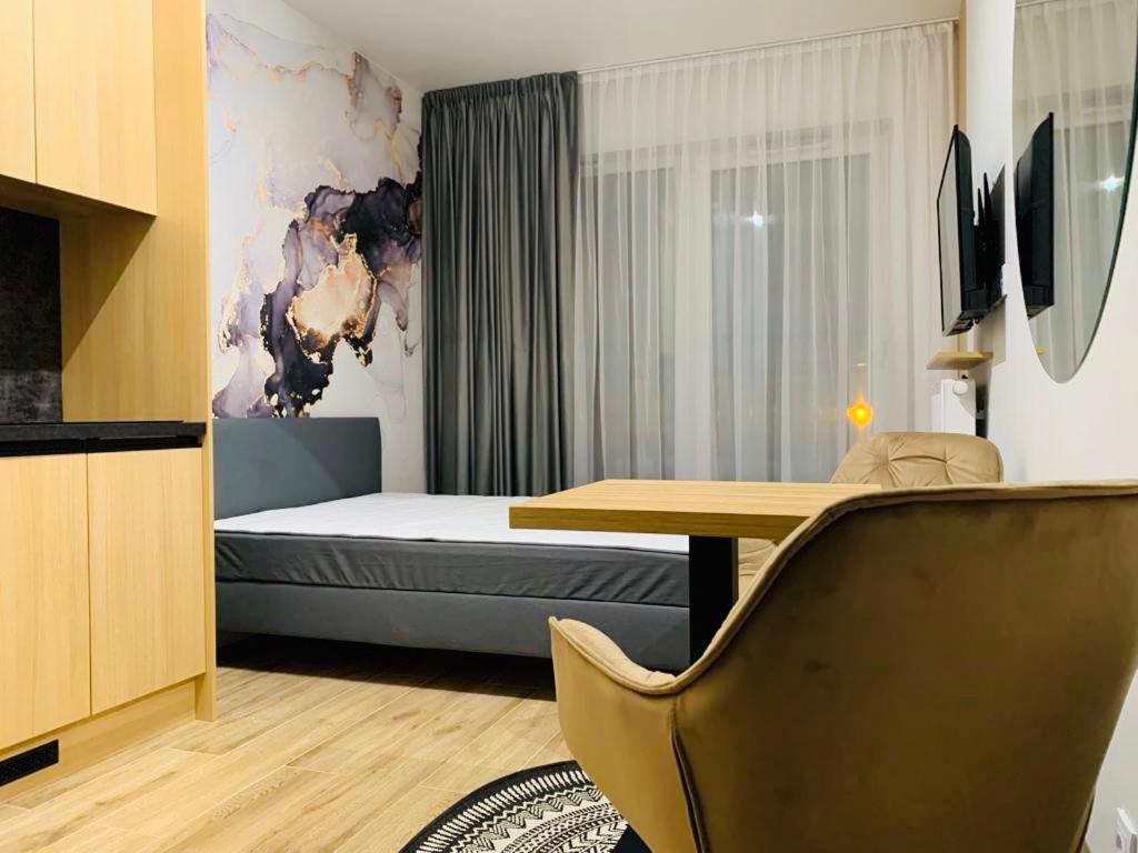 Postel nebo postele na pokoji v ubytování W Apartments