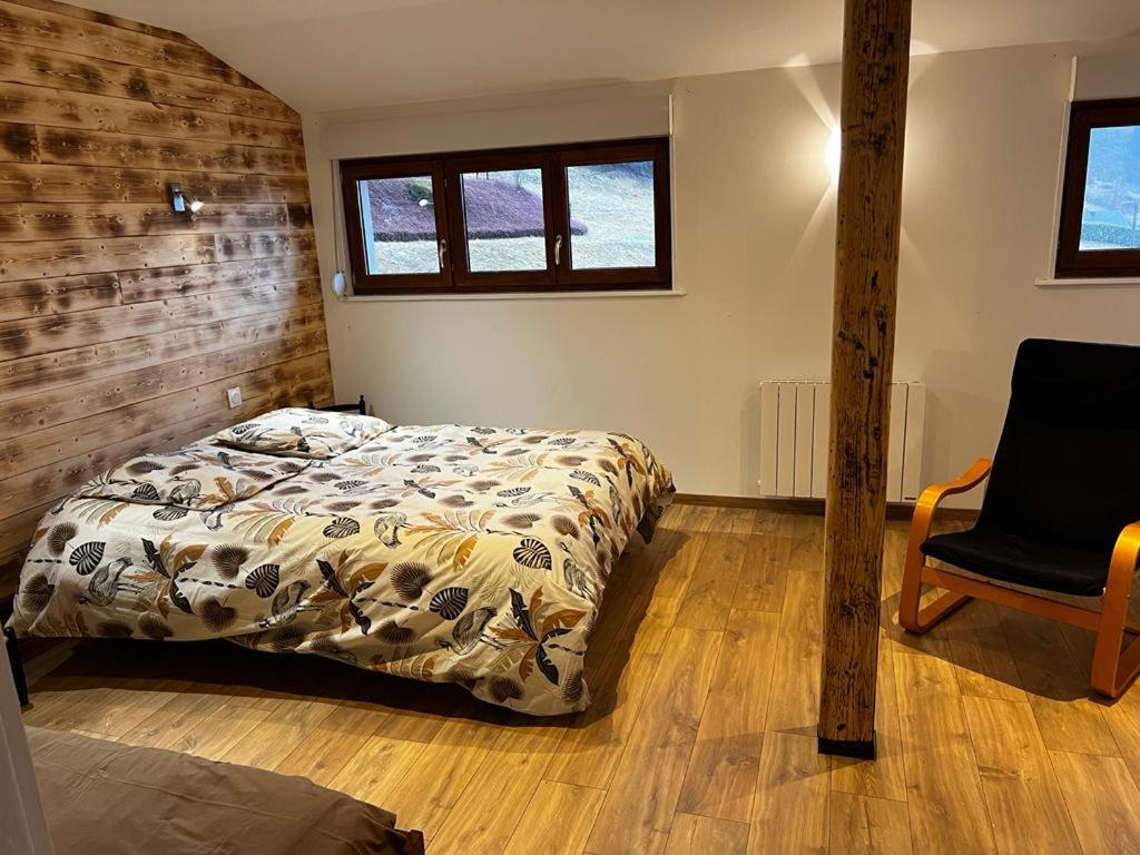 מיטה או מיטות בחדר ב-Gîte au pied du Mont