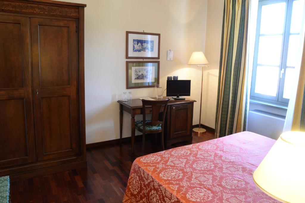 Postel nebo postele na pokoji v ubytování Villa Chiara Hotel