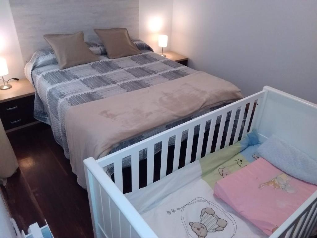 Posteľ alebo postele v izbe v ubytovaní Apartamento Portugalete
