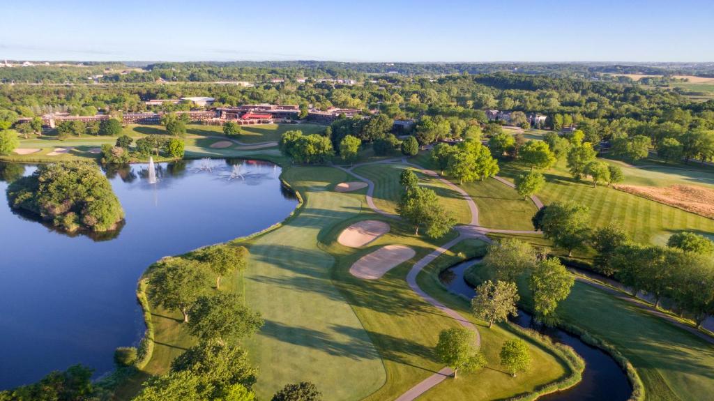 an aerial view of a golf course with a lake at Grand Geneva Resort and Spa in Lake Geneva