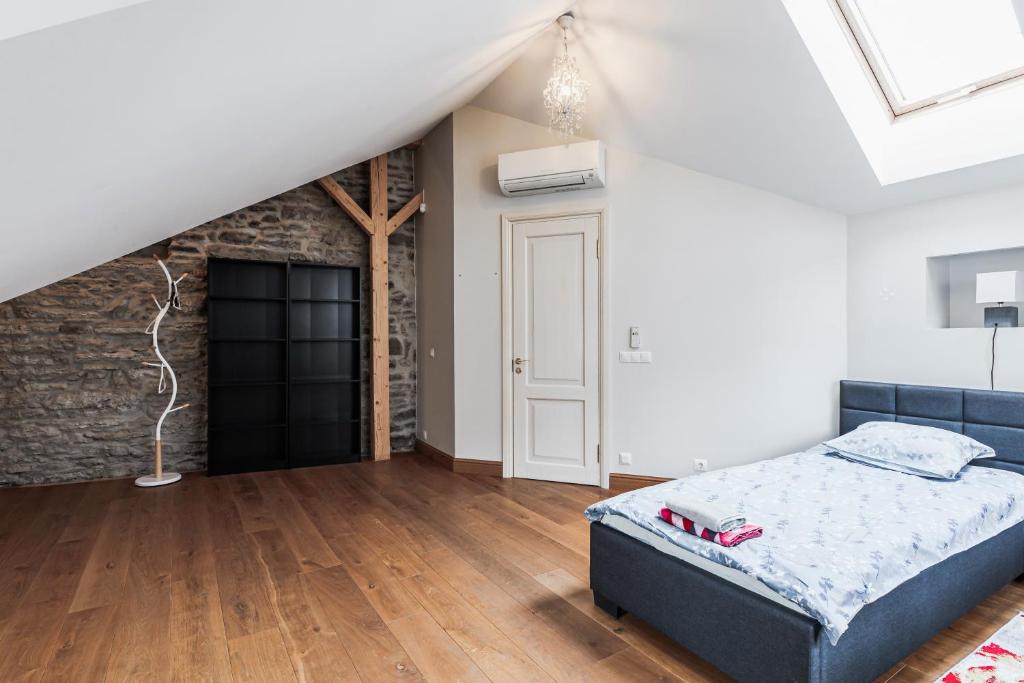 Postel nebo postele na pokoji v ubytování AirHome - Kuninga Apartment