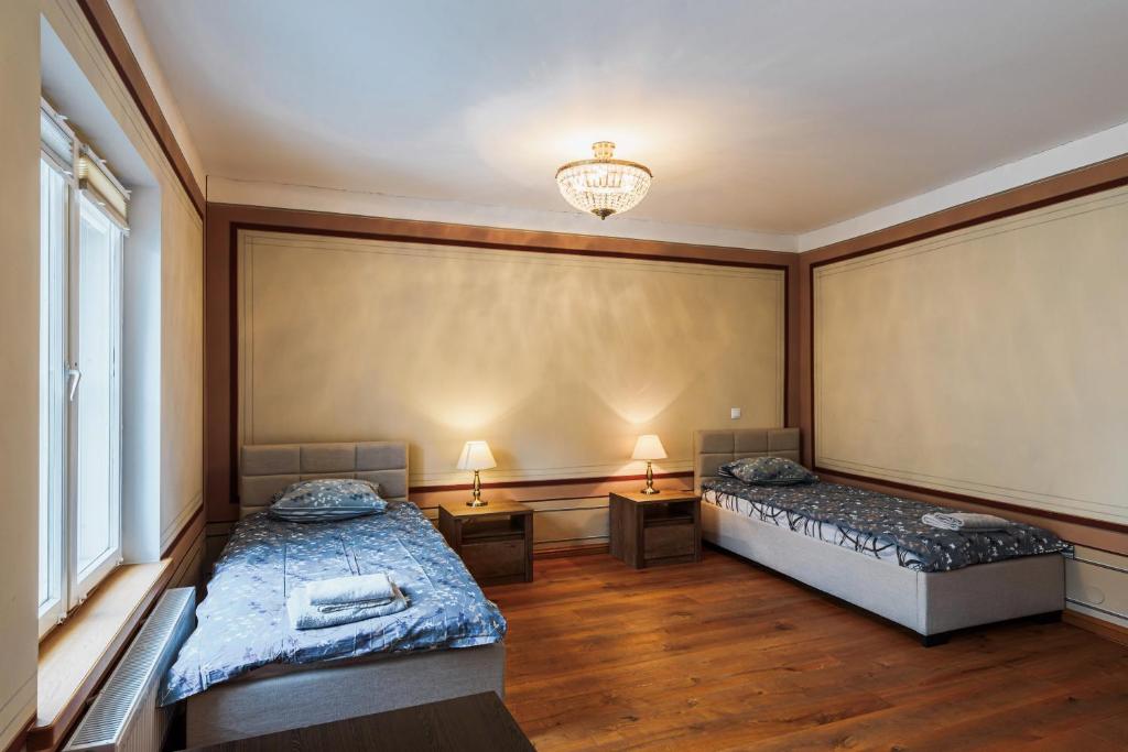 Postel nebo postele na pokoji v ubytování AirHome - Kuninga Apartment