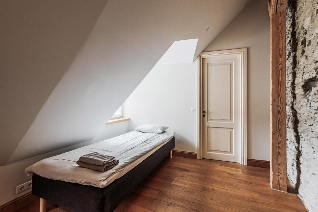 Postel nebo postele na pokoji v ubytování AirHome - Kuninga Apartment