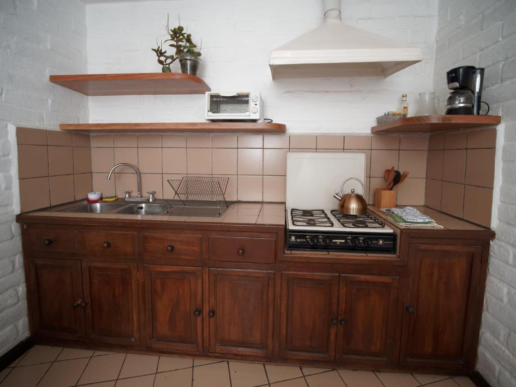 Kuchyň nebo kuchyňský kout v ubytování Apartamentos Otorongo Cuenca Ecuador
