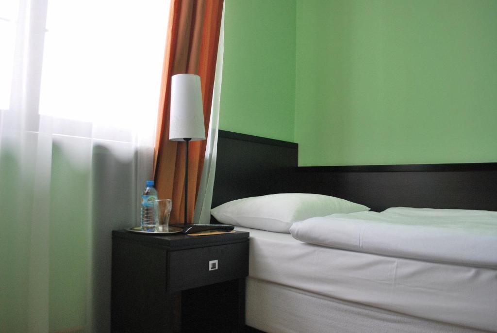Postel nebo postele na pokoji v ubytování K2 Pokoje