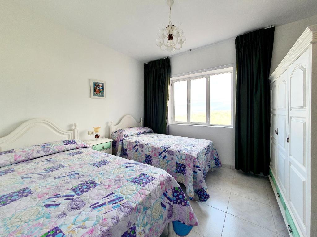 Postel nebo postele na pokoji v ubytování Apartamentos Romaris