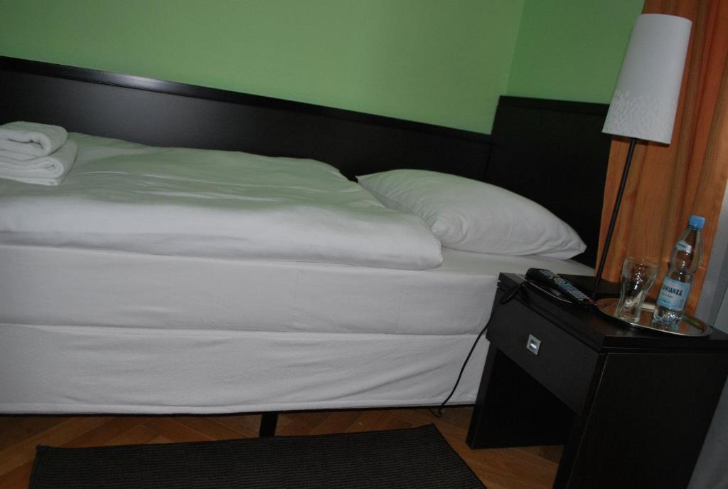 Postel nebo postele na pokoji v ubytování K2 Pokoje
