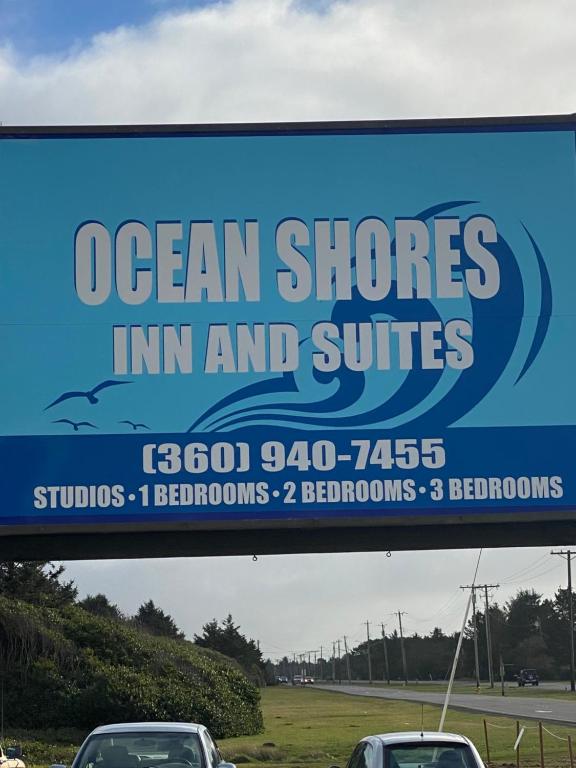 a sign on a highway with a picture of a truck on it at Ocean Shores Inn & Suites in Ocean Shores