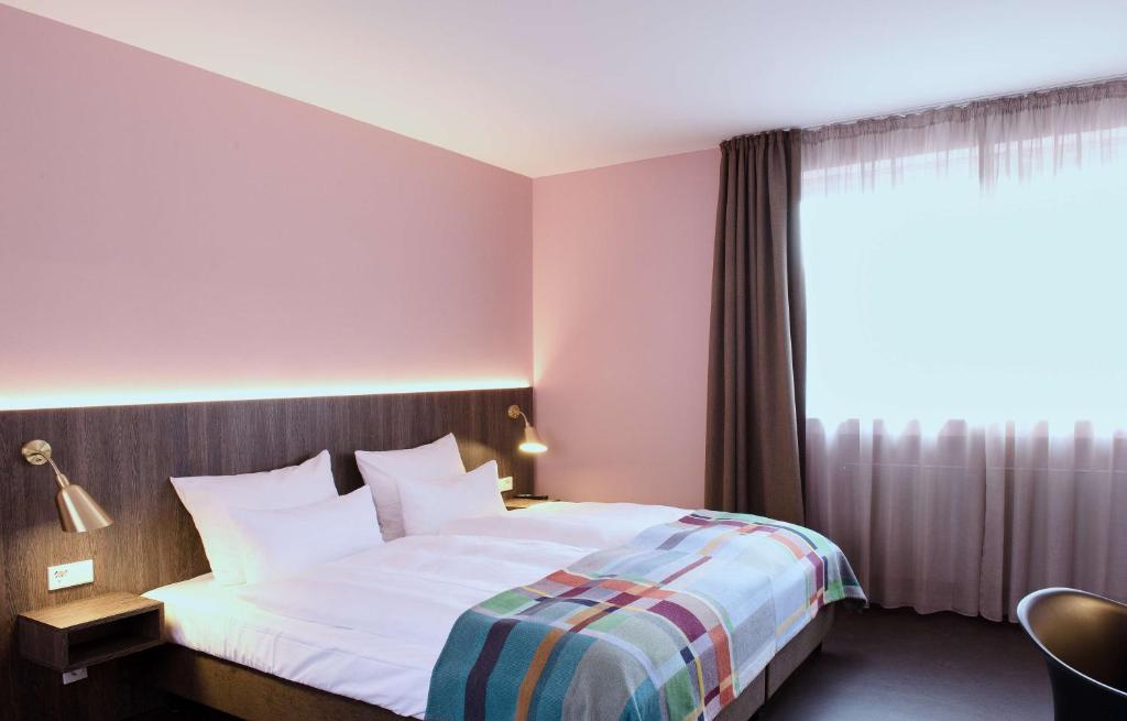 Postel nebo postele na pokoji v ubytování Central Hotel Münster
