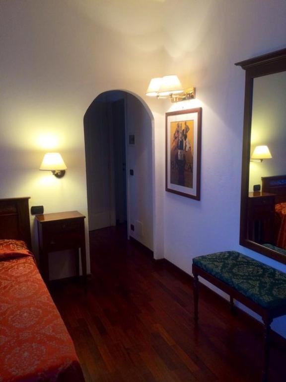 Postel nebo postele na pokoji v ubytování Villa Chiara Hotel