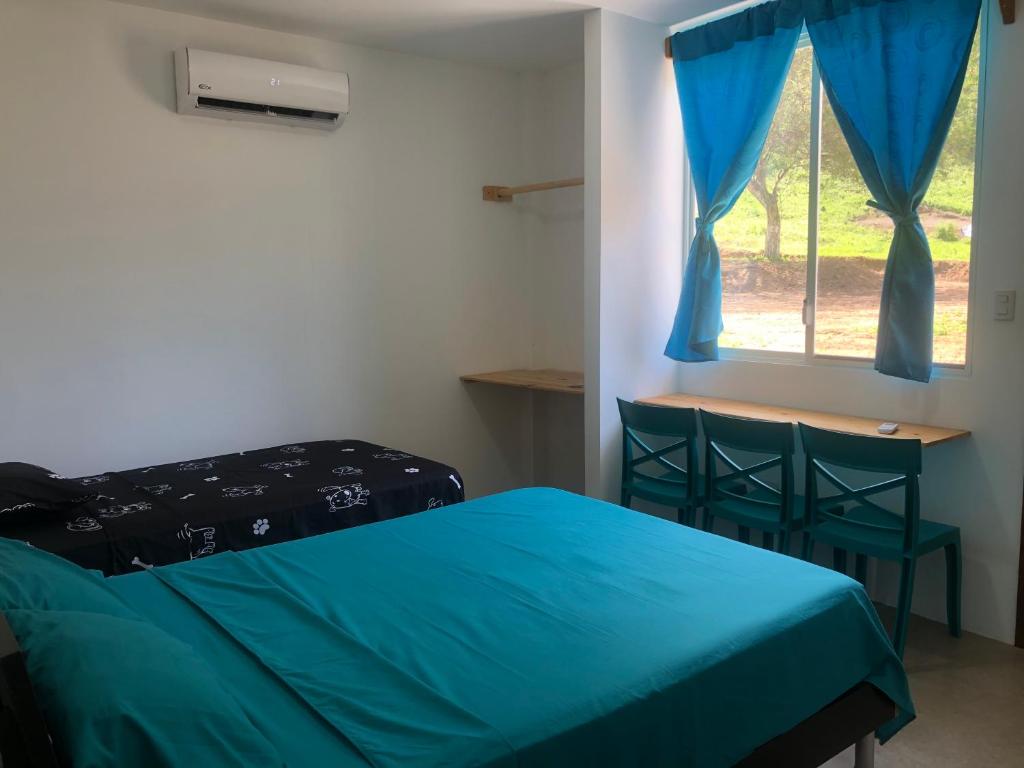 Postel nebo postele na pokoji v ubytování EL JARDIN OLON SUITES