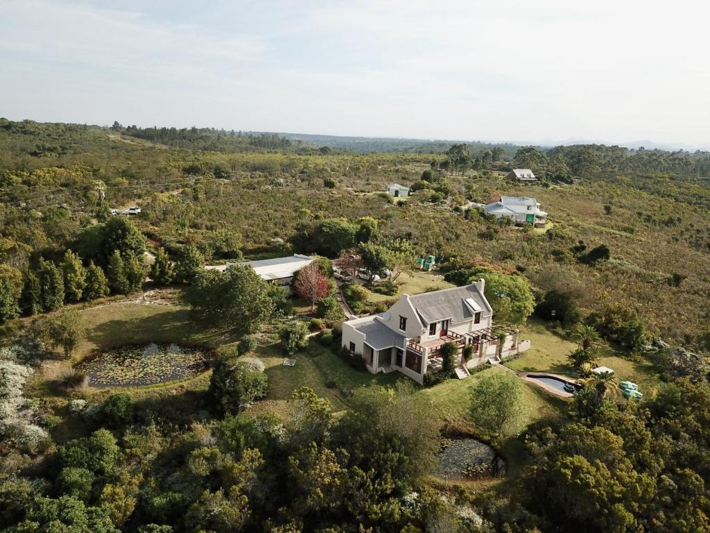 an aerial view of a large house on a hill at Colourful BnB in The Crags