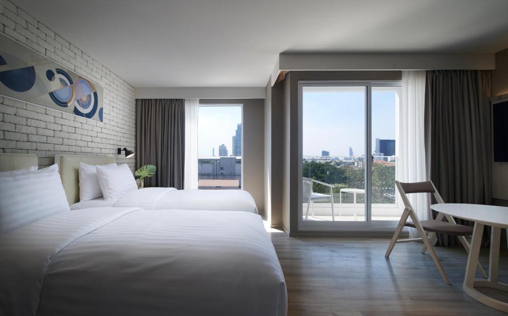 Giường trong phòng chung tại Shama Yen-Akat Bangkok