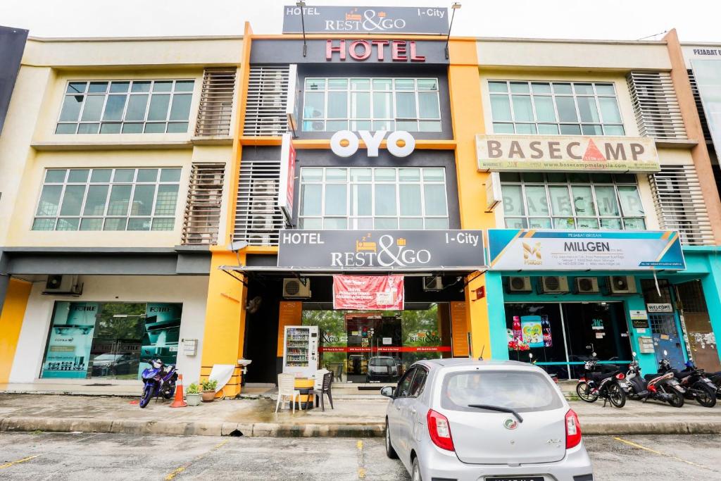 a car parked in front of a hotel at OYO 90460 Hotel Kl2f Rest & Go in Shah Alam